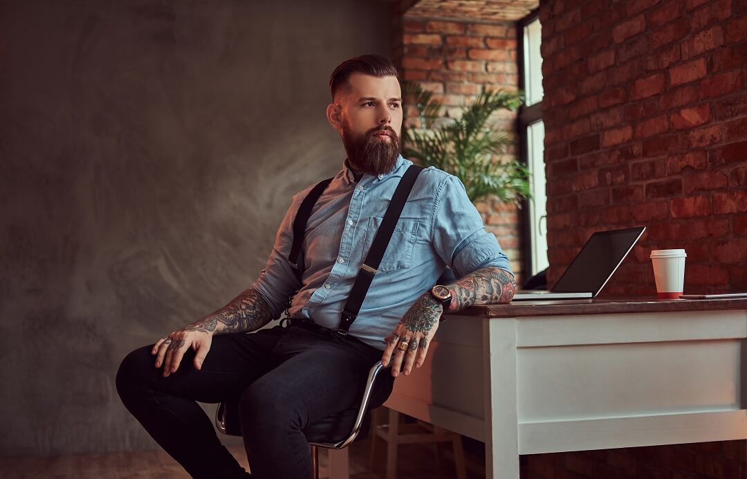 handsome-tattooed-hipster-in-an-office-with-loft-i-C6GJQ8H.jpg